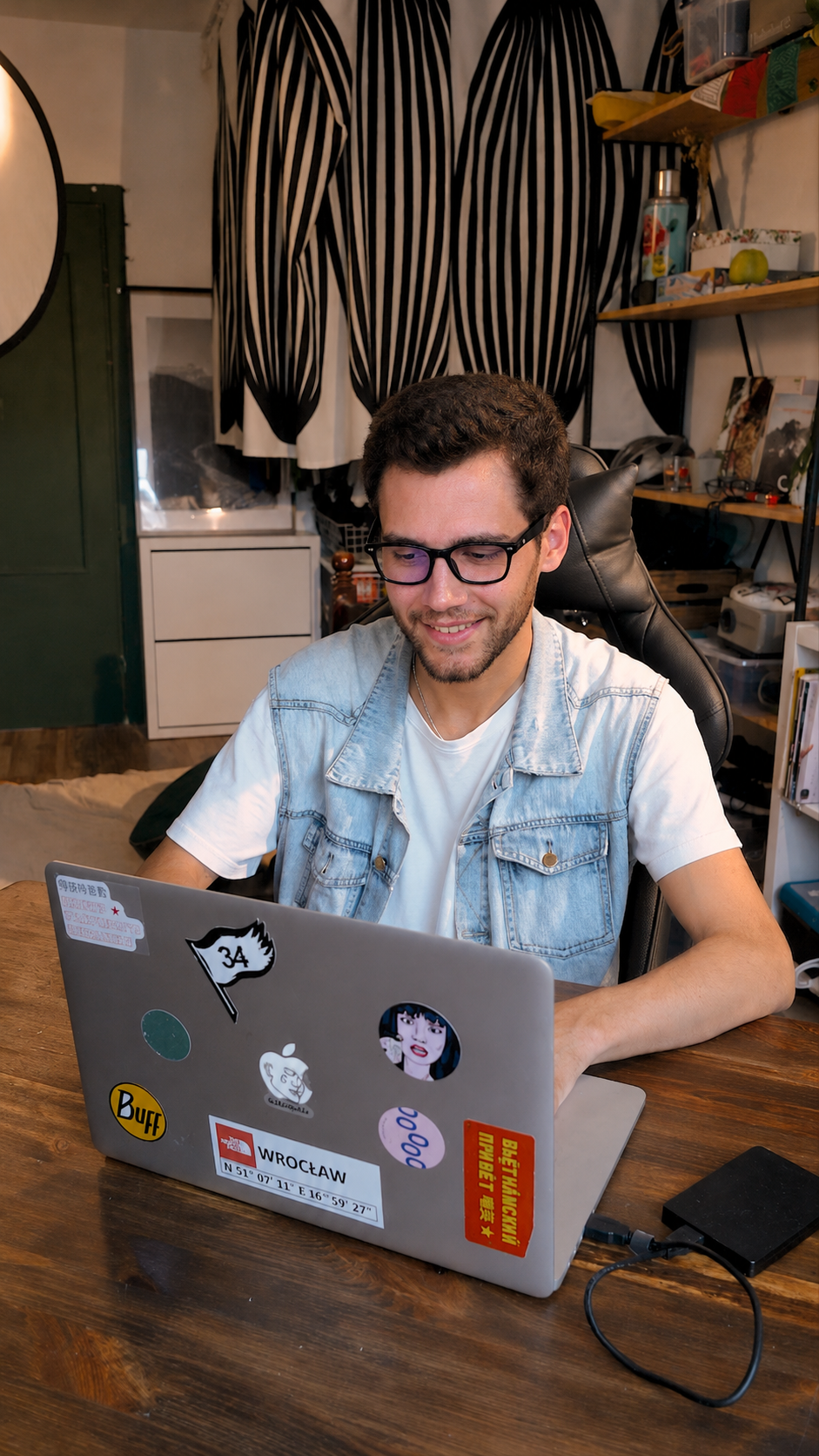 Stewiecore smiling at a laptop
